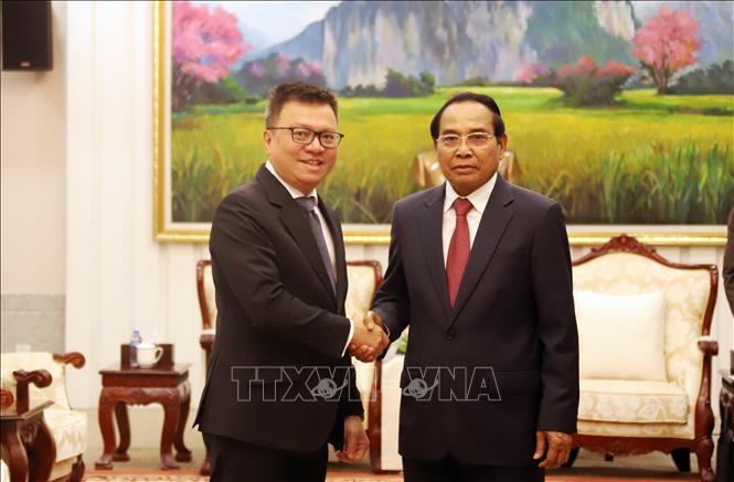 Lãnh đạo Lào đánh giá cao hiệu quả hợp tác giữa báo Nhân dân và báo Pasaxon